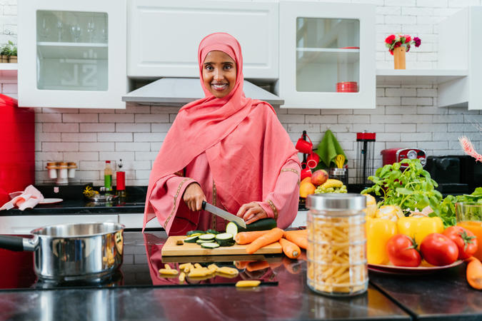 Woman wearing a headscarf preparing food